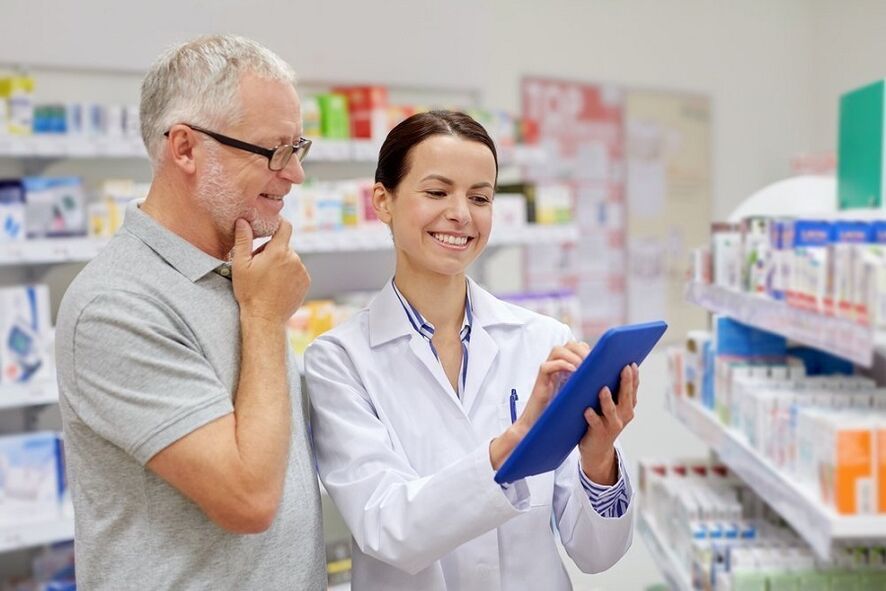 A doctor prescribes an antiparasitic medicine to a man